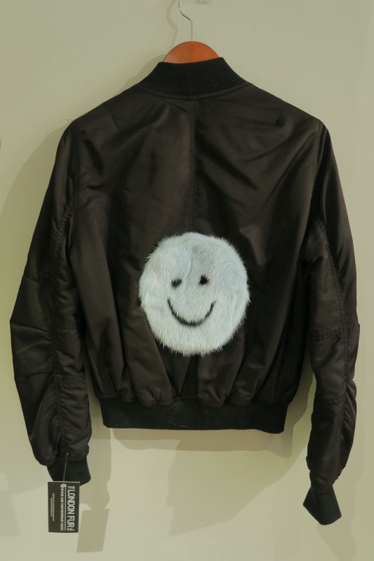 Upcycled black bomber with baby blue mink smiley
